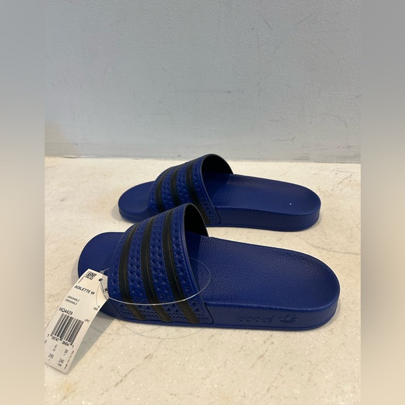 New with tags Adidas Adilette blue and black slides. Size 7 USA women’s - Picture 5 of 8